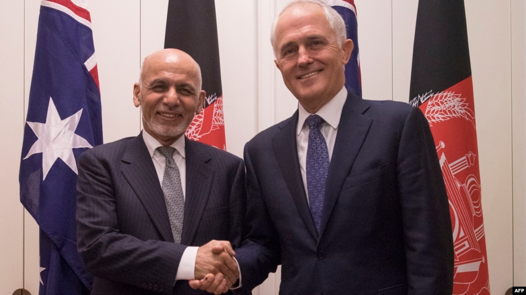 Australian Prime Minister Malcolm Turnbull (right) poses with the visiting Afghan President Ashraf Ghani in Canberra on April 3.