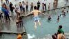 An boy jumps into the Cheshme-Ali pool located in the city of Shahre-Ray in central Iran, on July 22. (epa/Abedin Taherkenareh)