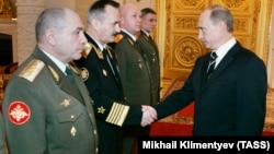 Russian Colonel General Nikolai Tkachyov (left) attends a meeting President Vladimir Putin at the Kremlin in Moscow in March 2007.