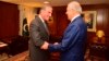 Pakistani Foreign Minister Shah Mahmud Qureshi (left) receives Zalmay Khalilzad in Islamabad on January 18. 