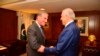 Pakistani Foreign Minister Shah Mahmud Qureshi, left, receives U.S. envoy Zalmay Khalilzad at the Foreign Ministry in Islamabad, January 18, 2019