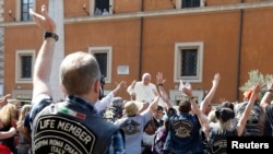 Pope Francis blesses Harley Davidson bikers outside St. Peter's Square in Rome.
