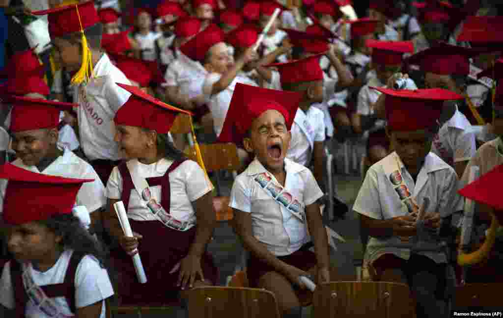 A child yawns during his kindergarten graduation ceremony in Havana, Cuba. (AP/Ramon Espinosa)