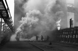 Three workers at the Kuznetsk Metallurgical Plant