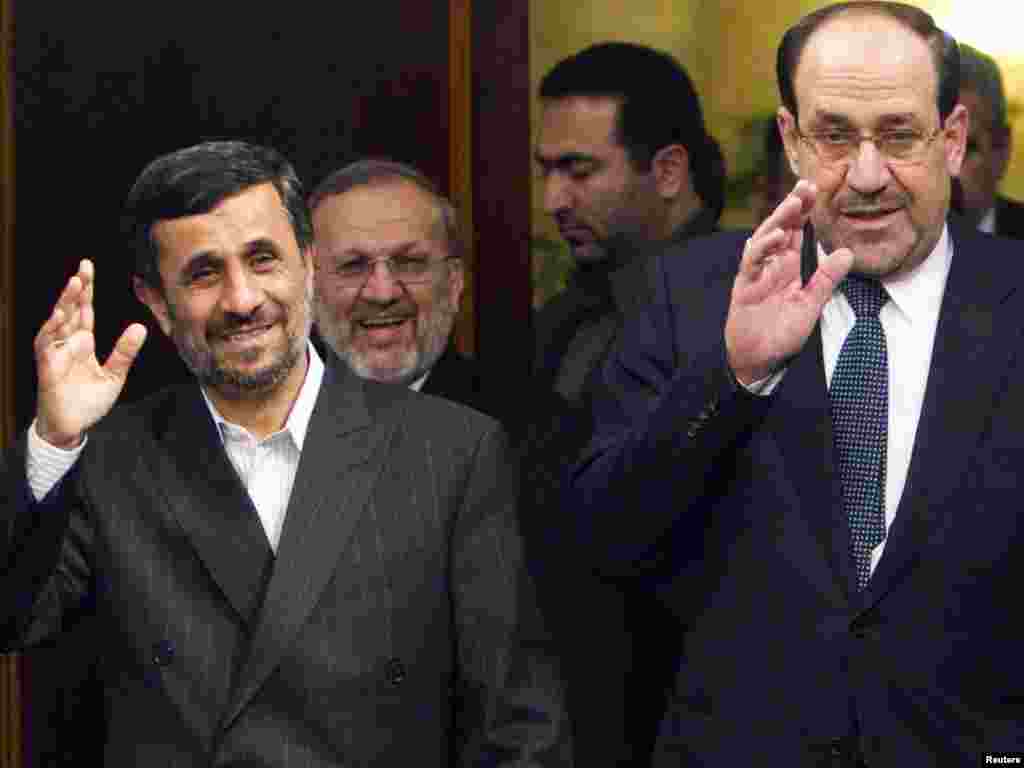 Iran -- President Mahmud Ahmadinejad (L) walks with Iraqi Prime Minister Nuri al-Maliki to start an official meeting in Tehran, 18Oct2010 - Iran's President Mahmoud Ahmadinejad (L) walks with Iraqi Prime Minister Nuri al-Maliki to start an official meeting in Tehran October 18, 2010. REUTERS/Raheb Homavandi (IRAN - Tags: POLITICS)