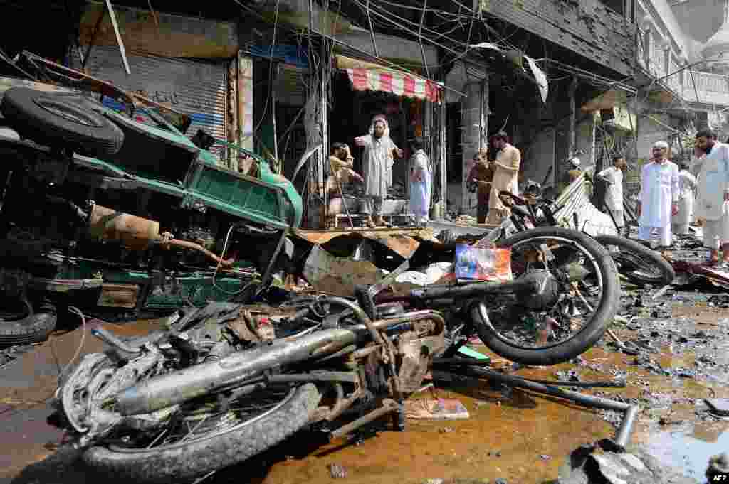 Shop owners survey the damage. 