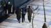 A protester is arrested in Minsk on January 23.