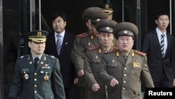 North Korean Colonel Ri Son-kwon (front right) led talks for the North in the village of Panmunjom. 