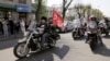 Bikers of the Russian motorcycle club Night Wolves leave the Russian Consulate in Brest, Belarus, after a press conference on April 28.