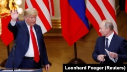Президент США Дональд Трамп и президент России Владимир Путин на совместной пресс-конференции после их встречи в Хельсинки, 16 июля 2018 года