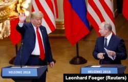 Дональд Трамп и Владимир Путин во время совместной пресс-конференции в Хельсинки. 16 июля 2018 года