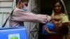 A Pakistani health worker administers polio vaccine drops to a child during a vaccination campaign. (file photo)
