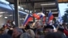 Ukraine - Residents of the Crimean city of Simferopol cheered the arrival of a train from Moscow, the first to make that journey since transport links with mainland Ukraine were severed five years ago. roundup screen grab