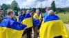Ресей тұтқынынан еліне оралған украин сарбаздары. 9 маусым, 2025 жыл (Украина президентінің баспасөз қызметі жариялаған сурет)