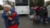 Civilians evacuated from the Russian-controlled Kherson region of Ukraine arrive in Dzhankoi, in the north of Crimea, on October 20. 