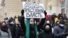 People take part in a protest rally in support of detained opposition leader Aleksei Navalny in Moscow on January 31.