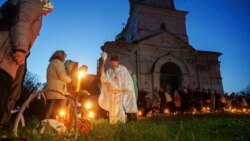 Priest Serhiy Zezul blesses Easter baskets in front of a church destroyed in fighting between Russian and Ukrainian forces in the village of Lukashivka, Ukraine, on April 20.