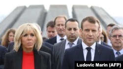 French President Emmanuel Macron and his wife, Brigitte Macron, during a visit at Yerevan's Tsitsernakaberd Armenian Genocide Memorial on October 11.