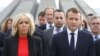 French President Emmanuel Macron (left), first lady Brigitte Macron, members of the French delegation, and Armenian officials visit the Tsitsernakaberd Armenian Genocide Memorial in Yerevan in October.