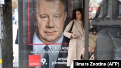 An election poster for the pro-Kremlin Harmony party on display at a bus stop in Riga earlier this week.