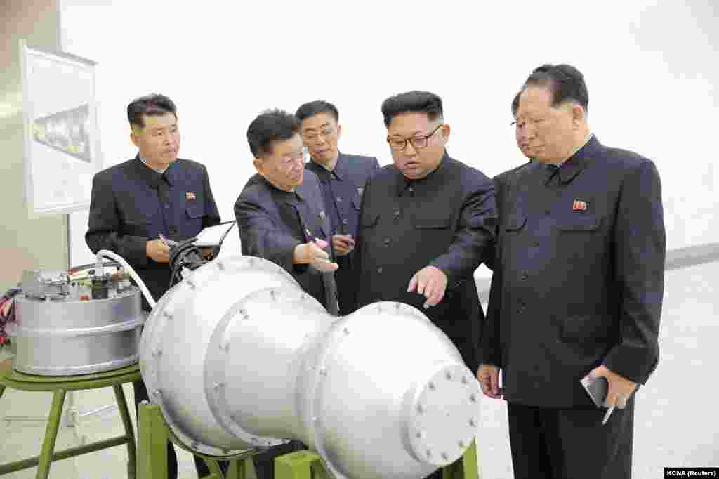 Kim inspecting what North Korean media claimed was a hydrogen bomb small enough to be slotted into an intercontinental ballistic missile (ICBM). The North Korean leader doubled down, responding to Trump's challenge by threatening U.S. territory (Guam) with “an enveloping fire.”
