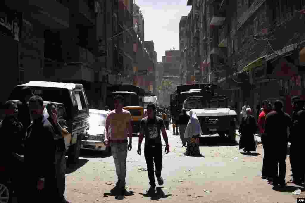 Egyptian security vehicles remain stationed in a poor area of the Qaliubia governorate, north of Cairo, following sectarian clashes between Christians and Muslims on April 6, which left five people dead. (AFP)