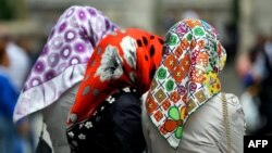 The ruling is the first on the issue of women wearing head scarves at work in the European Union.