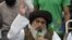 Khadim Hussain Rizvi speaks to supporters during a protest following the Supreme Court's decision to acquit Pakistani Christian woman Asia Bibi of blasphemy, in Lahore on November 2.