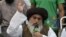 TLP head Khadim Hussain Rizvi speaks to supporters during a protest following the Supreme Court's decision to acquit Asia Bibi of blasphemy, in Lahore on November 2.