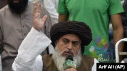 Khadim Hussain Rizvi speaks to supporters during a protest following the Supreme Court's decision to acquit Pakistani Christian woman Asia Bibi of blasphemy, in Lahore on November 2.