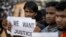Rohingya refugees holding signs as they await the arrival of a UN Security Council team at the Kutupalong Rohingya refugee camp in Kutupalong, Bangladesh on April 29, 2018.