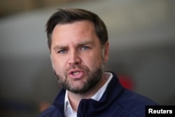 Vice President JD Vance speaks to reporters before boarding Air Force Two, at Elmendorf Air Force Base, in Anchorage, Alaska, on October 6.