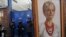 A supporter of Yulia Tymoshenko holds her portrait during rally in front of a prison in Kyiv last year.