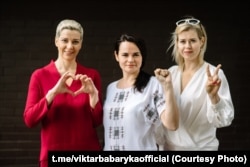 Using gestures that have since become iconic opposition symbols, Svyatlana Tsikhanouskaya clenches her fist, Maryya Kalesnikava makes a heart sign, and Veranika Tsapkala signals V for victory while campaigning ahead of Belarus's disputed presidential election in 2020.