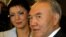 Kazakh President Nazarbayev looks on standing next to his daughter Dariga during opening of the Eurasian Media Forum in Almaty.  Kazakh President Nursultan Nazarbayev looks on standing next to his daughter Dariga (L) during opening ceremony of the 4th Eur