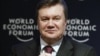Ukrainian President Viktor Yanukovych attends a session at the World Economic Forum in Davos last year. A new report highlights his administration's lack of progress in implementing economic reform. 