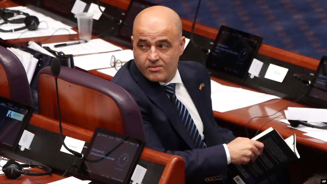 Prime Minister Dimitar Kovachevski looks back during the debate in parliament on July 16. He urged lawmakers to accept an imperfect deal that would lead to "ultimately a better future."