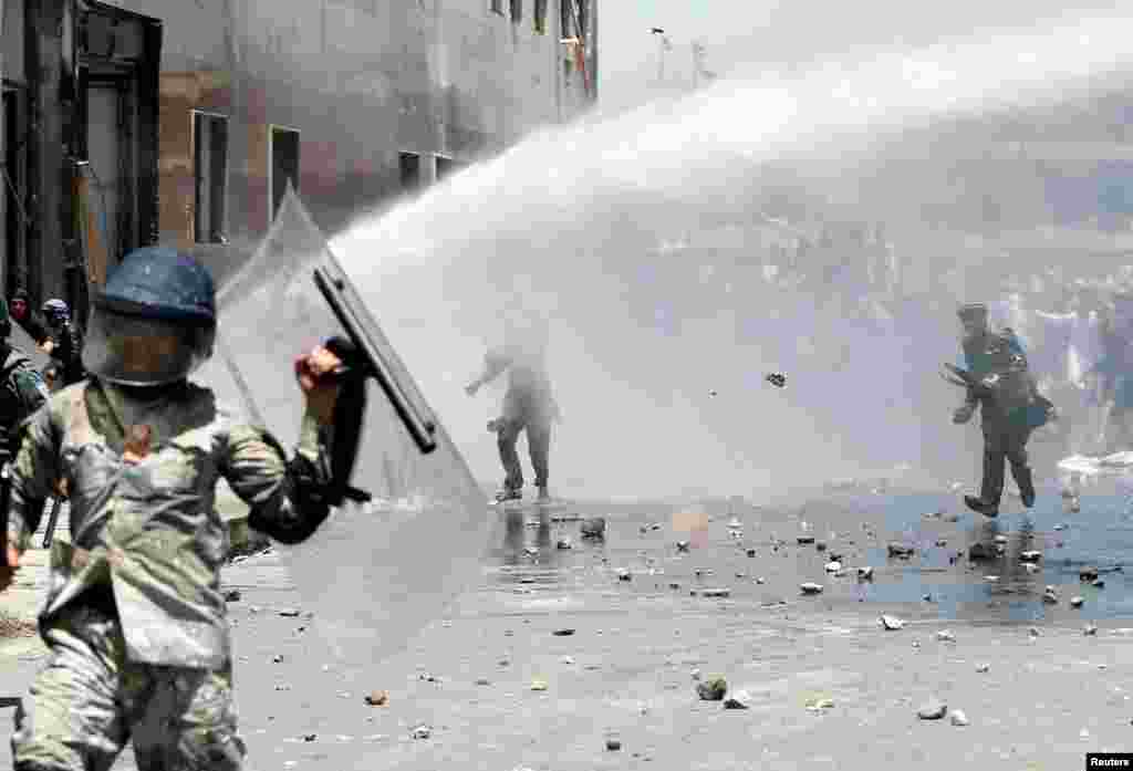 Afghans throw stones at security forces during a protest in Kabul on June, 2. (Reuters/Omar Sobhani)