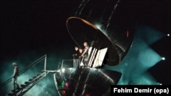 U2 emerges from a giant capsule at their performance in Sarajevo on September 23, 1997.