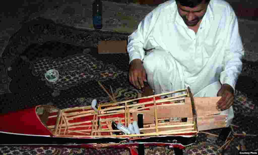 Afghanistan - An Afghan makes drone design plane in southern Afghanistan, 29Mar2012