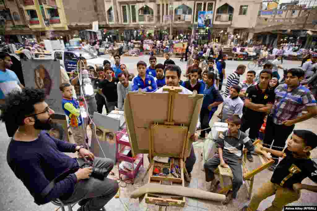 An artist paints a portrait in a city square.