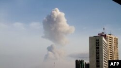 A plume of smoke can be seen over the Congolese capital, Brazzaville, after a series of explosions in the city on March 4.