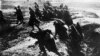 French soldiers move into attack from their trench during the Verdun battle in 1916.