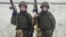 Russian conscripts Konstantin (right) and Dmitry Reshka, 20, were called up in November 2023 for military service, but the twin brothers had no intention of serving for longer than the required year.