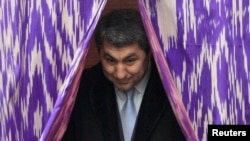 Kabiri leaves the ballot booth at a polling station during parliamentary elections in Dushanbe in February 2010.