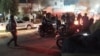 Riot police forces struggle to disperse protesters in Tehran Province on the sixth night of protests on January 2.