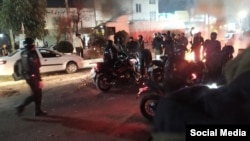 Riot police forces struggle to disperse protesters in Tehran Province on the sixth night of protests on January 2.
