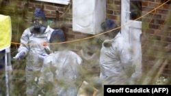 Investigators work in the garden of Russian ex-spy Sergei Skripal's house in Salisbury, England, last week.