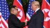 North Korean leader Kim Jong Un (left) shakes hands with U.S. President Donald Trump.