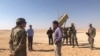 FILE - U.S. Defense Secretary Mark Esper speaks with U.S. troops in front of a Patriot missile battery at Prince Sultan Air Base, October 22, 2019